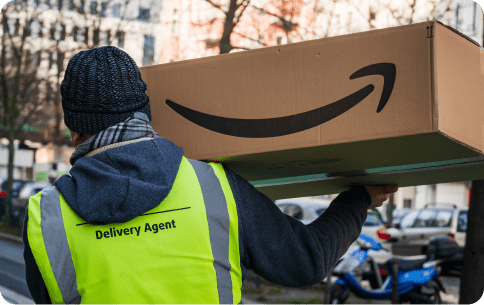Amazon delivery man with box and light reflective vest