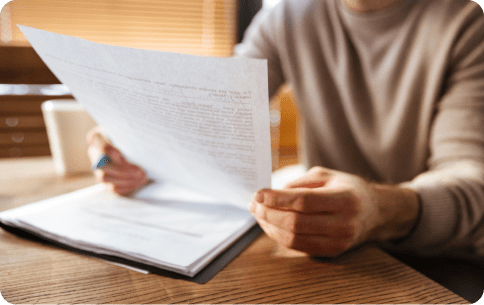 man holding paper in the office